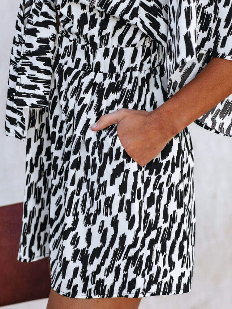 White V-Neck Printed Tie Romper with Pockets