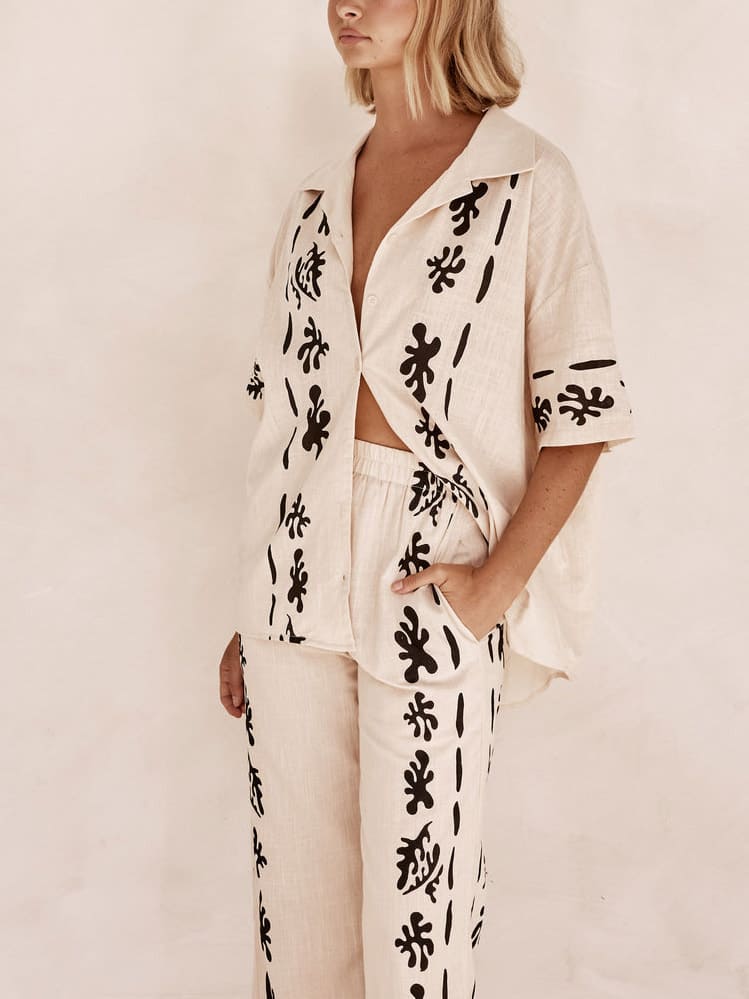 Set of Cream Wide Leg Trousers with Black Print