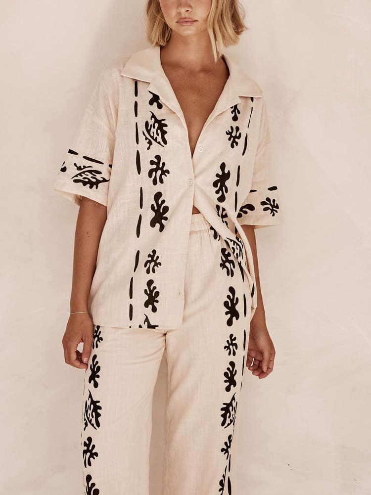 Set of Cream Wide Leg Trousers with Black Print