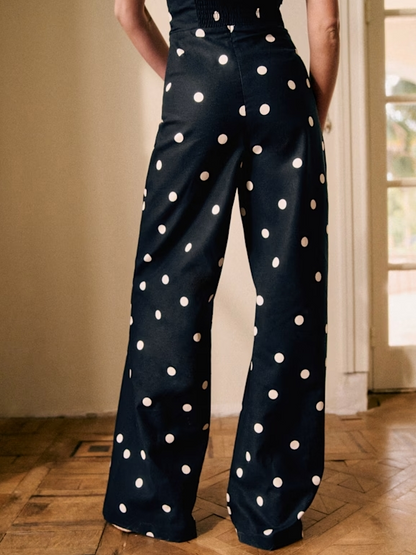 Ecru Polka Dot Jumpsuit on Black Background